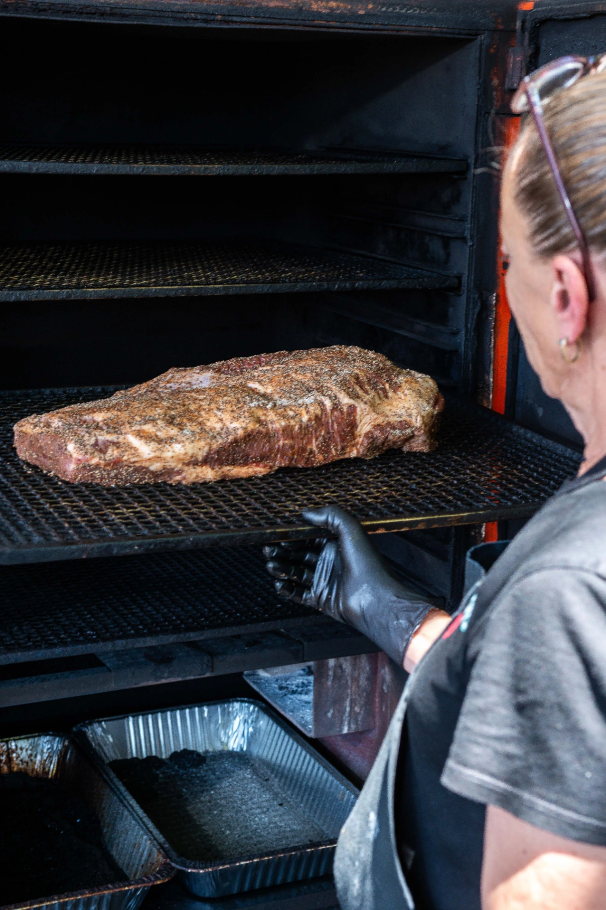 Pitmaster tending the smoker